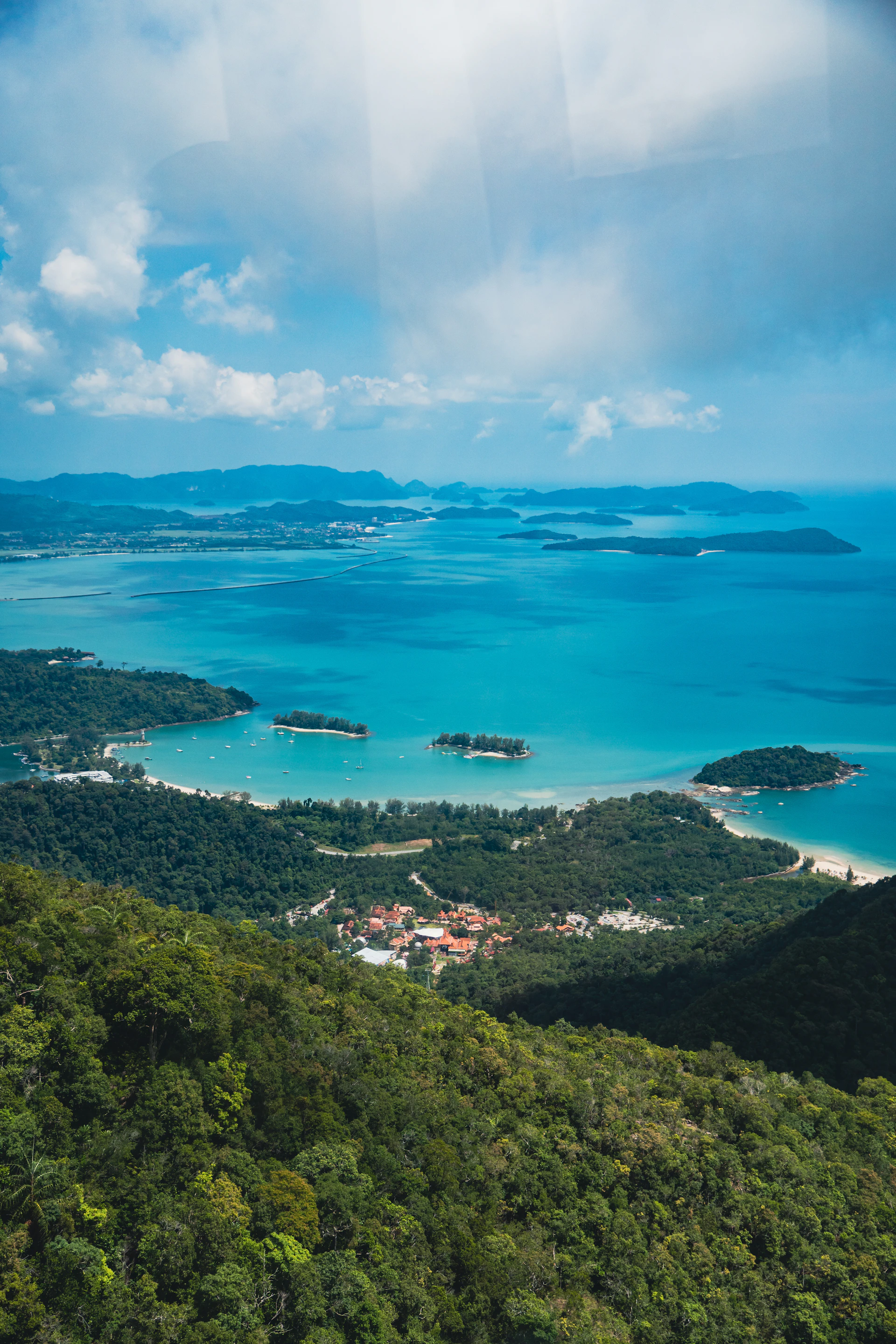 Panoramic view of the Andaman Sea and forested coastline from a Langkawi hilltop