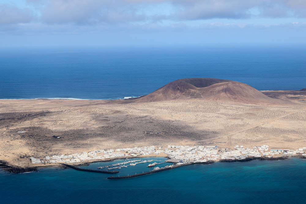 an aerial view of a small island in the middle of the ocean