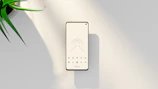 A sleek smartphone displaying a minimalist productivity app interface with calming blue tones.