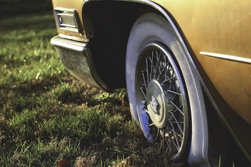 a close up of a car tire on the grass