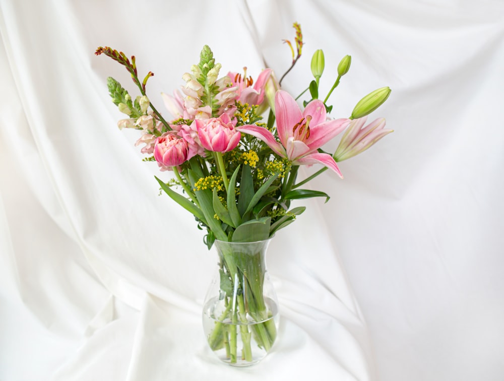 a bouquet of flowers in a vase on a table