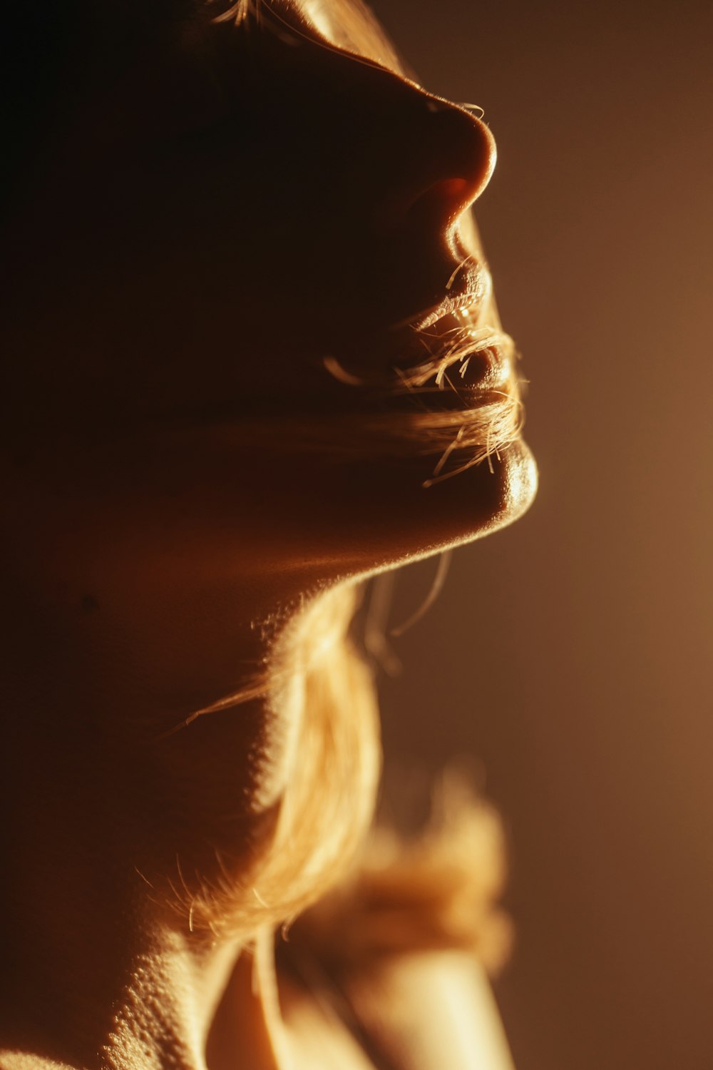 a close up of a woman's face and neck