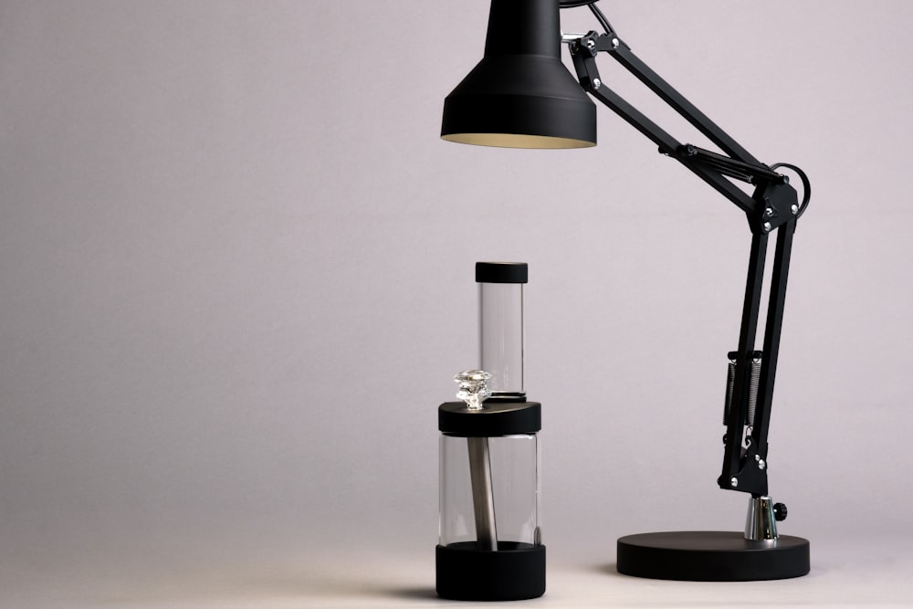 a desk lamp with a glass tube underneath it