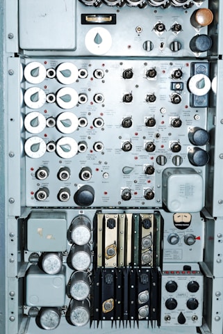 Close-up of a control panel featuring DCS and PLC components.