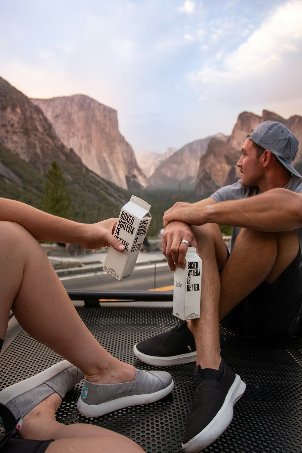 a person sitting on top of a mountain