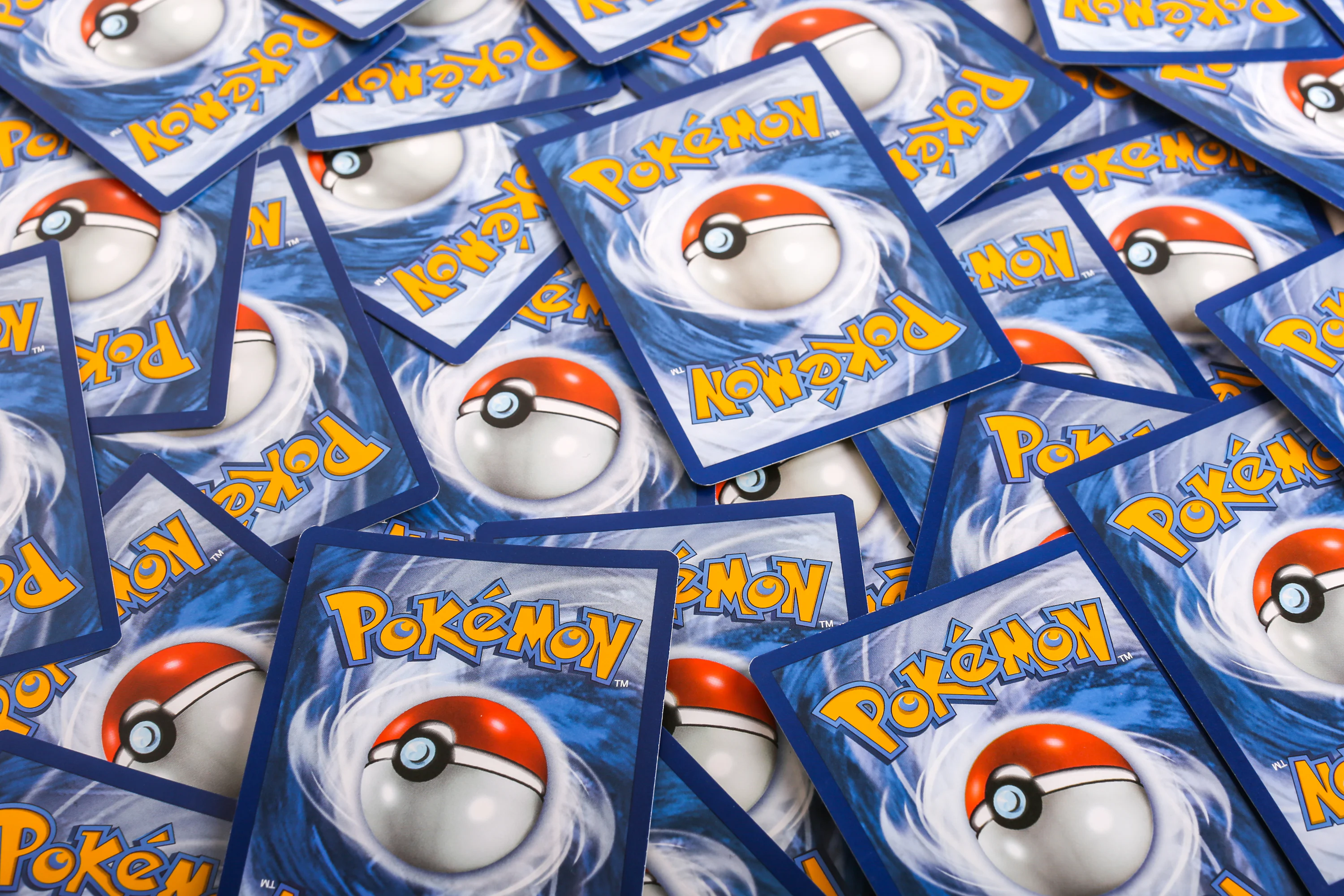 pokemon card stack TCG: Stacking Tin BoomLoot or feisty Ogerpon and its masks A pile of pokemon trading