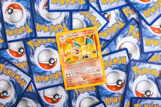 a pile of pokemon trading cards sitting on top of each other