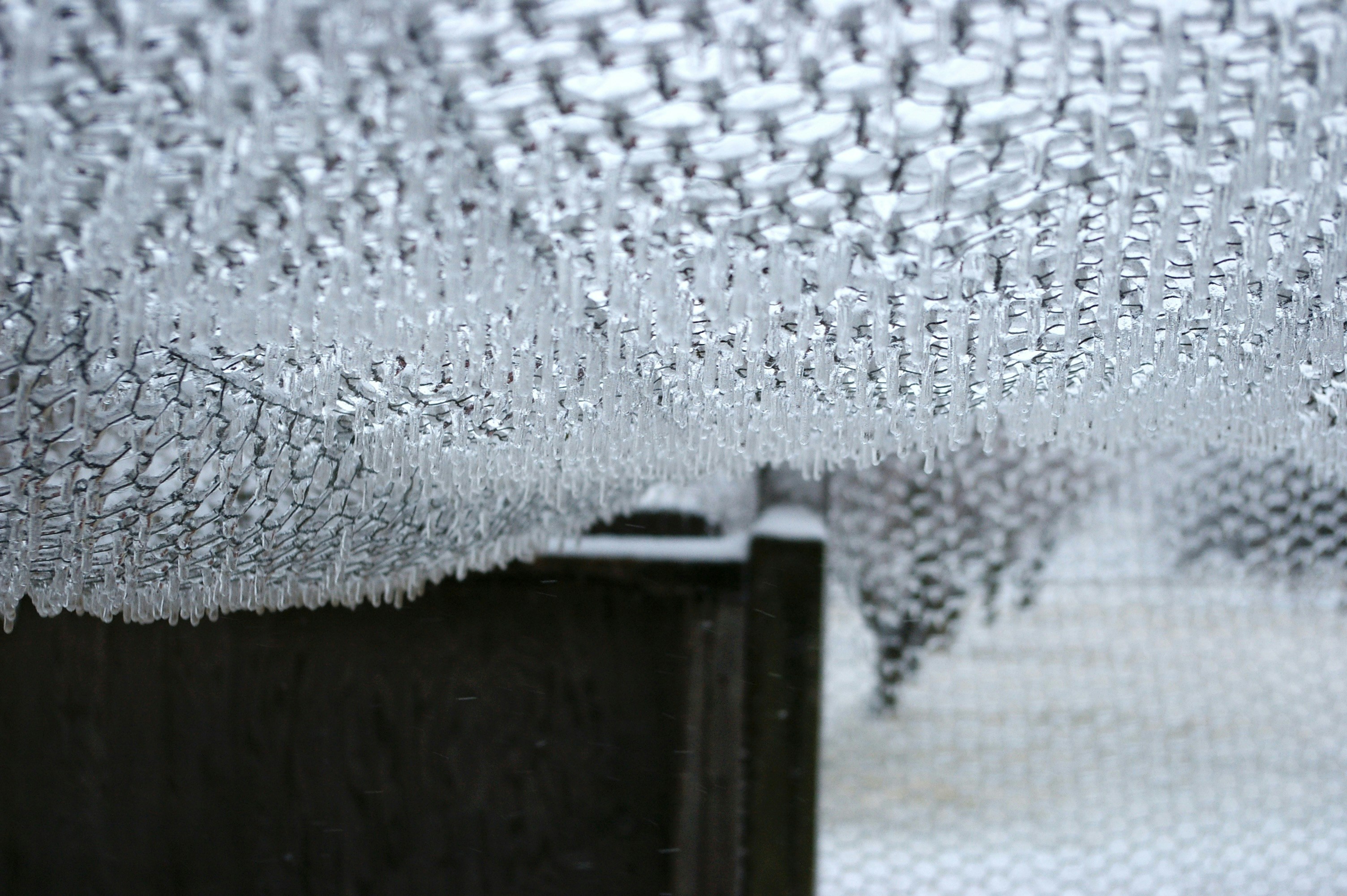 a close up of a curtain with water drops on it