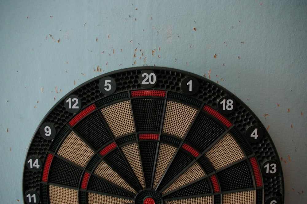 a close up of a dart board on a wall