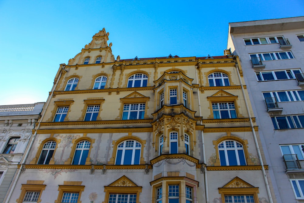 a large building with many windows and a clock on the front of it