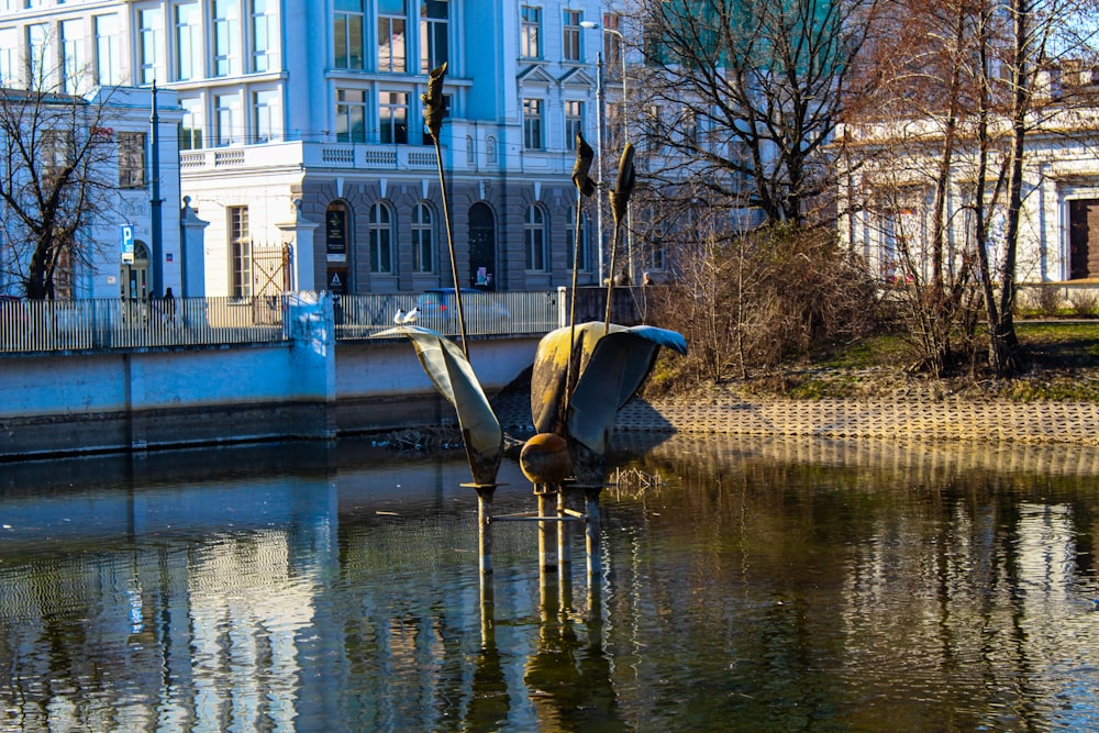 a boat sitting in the middle of a body of water