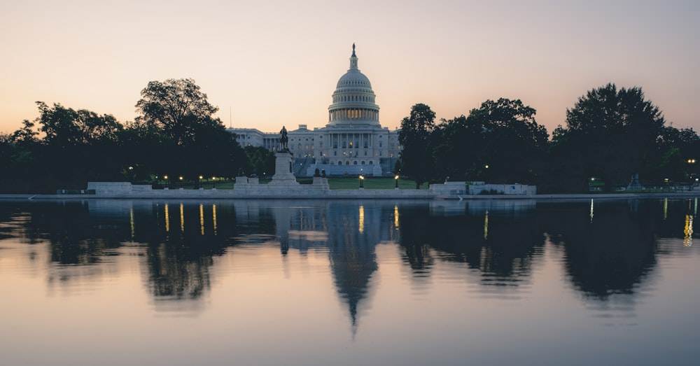 the capitol building is reflected in the water