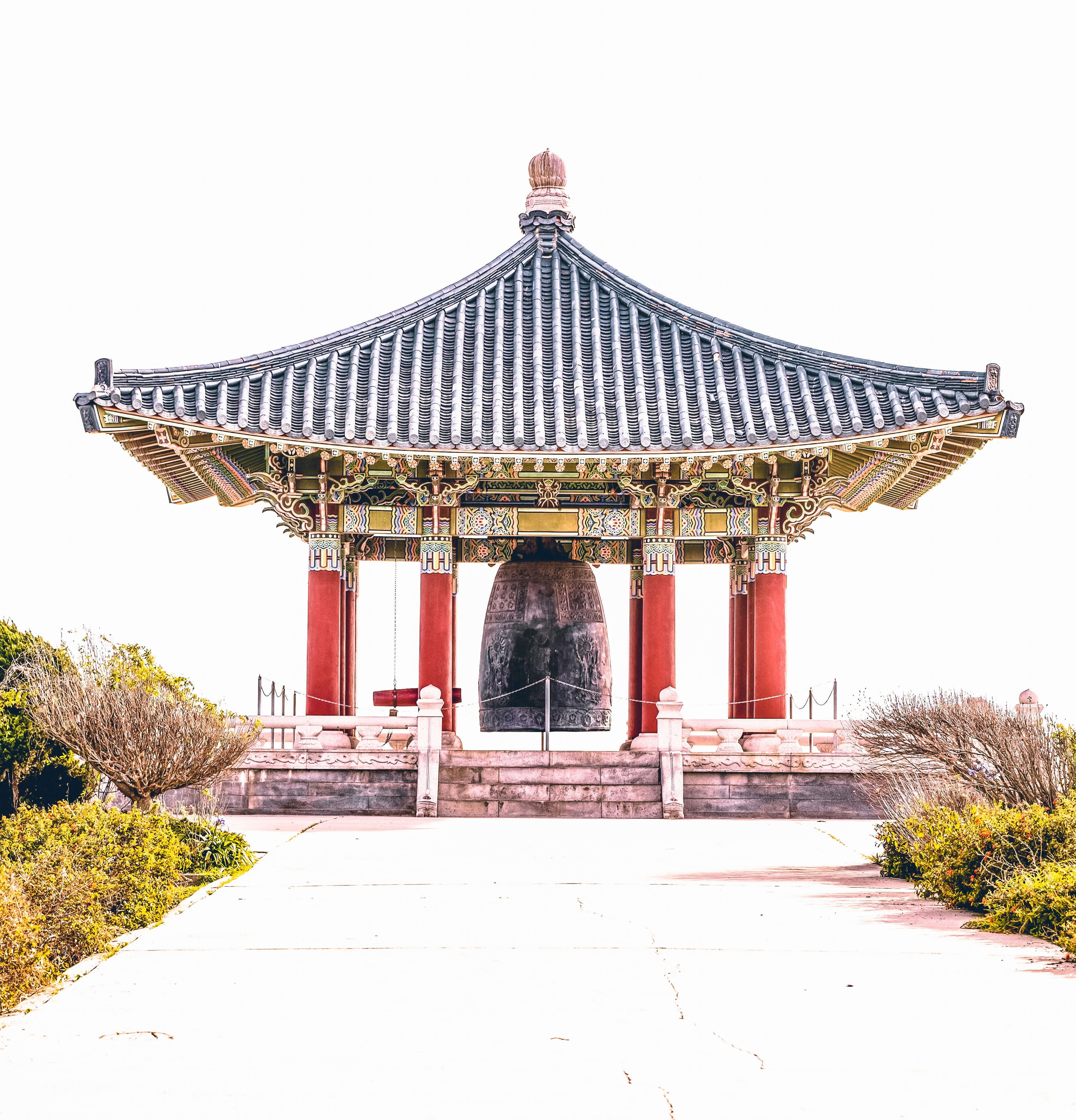 a tall building with a bell on top of it