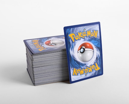 a stack of pokemon cards sitting on top of each other