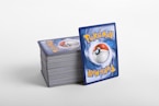 a stack of pokemon cards sitting on top of each other