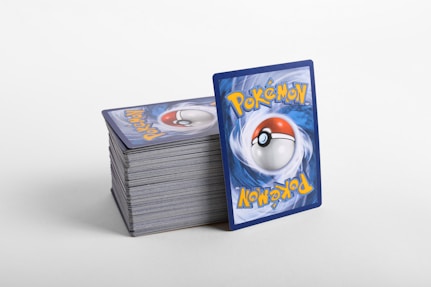 a stack of pokemon cards sitting on top of each other