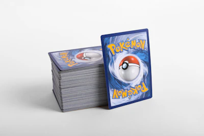 a stack of pokemon cards sitting on top of each other