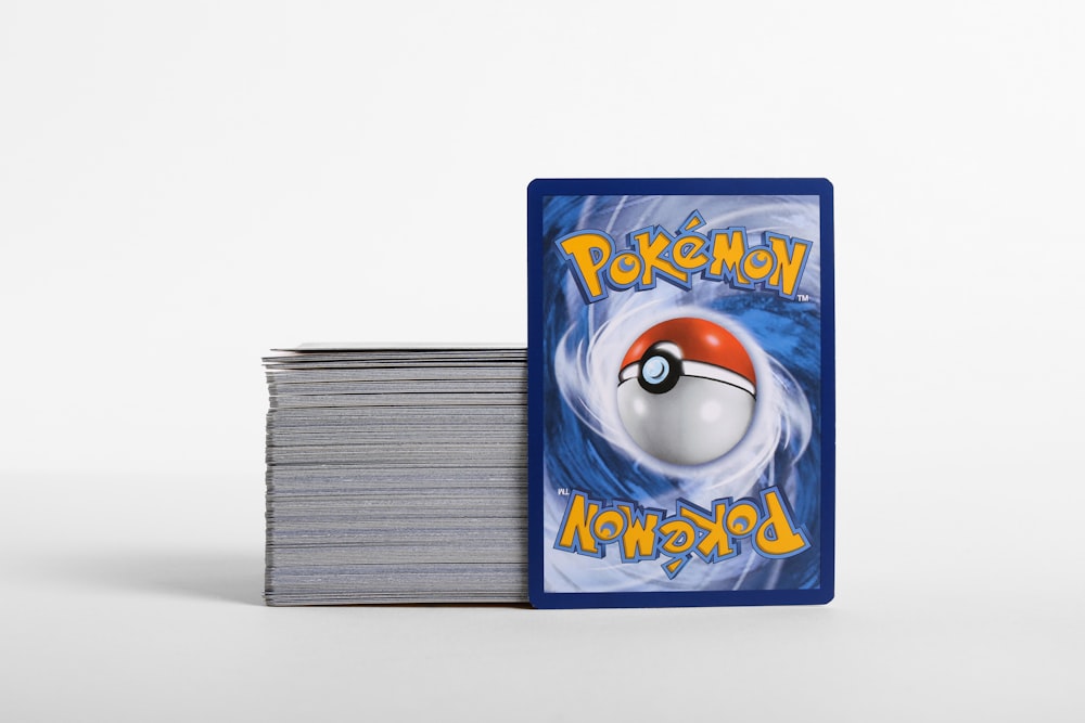 a stack of cards with a pokemon logo on them
