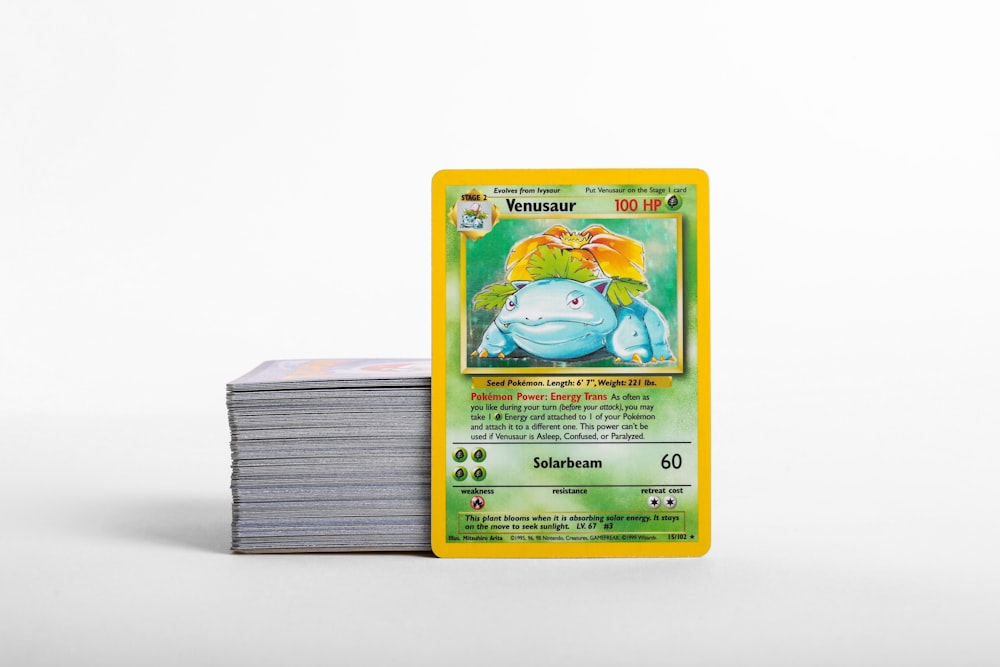 a stack of pokemon cards sitting on top of each other