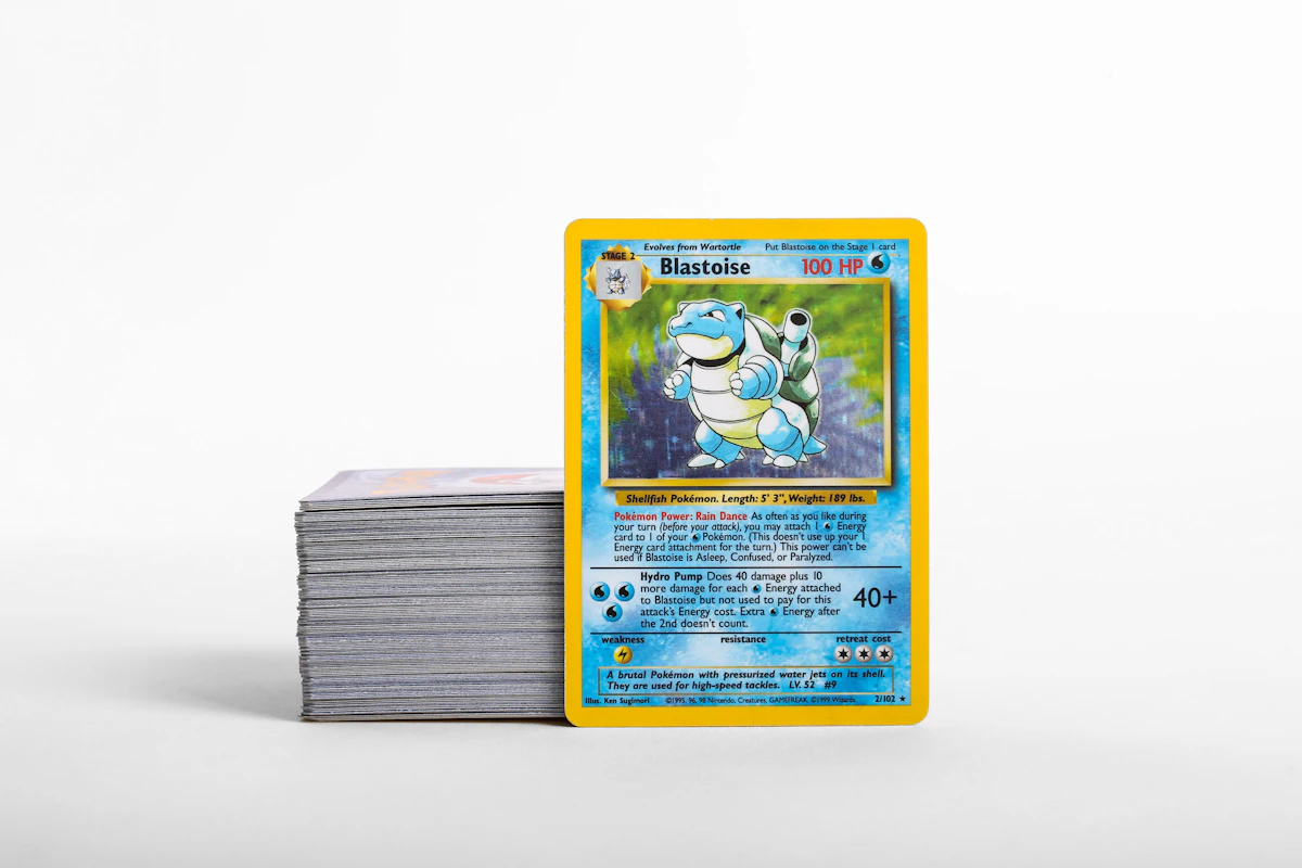 A stack of Pokemon cards sitting on top of each other