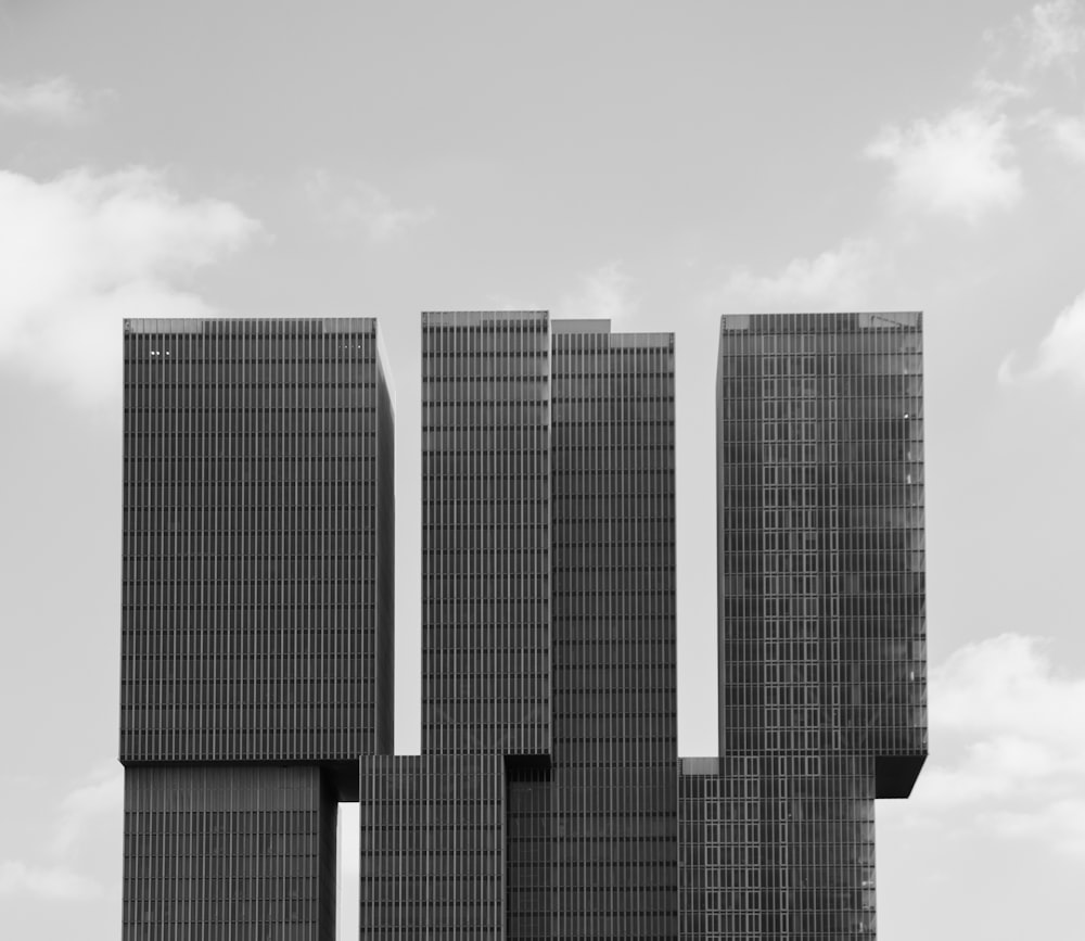 a black and white photo of two tall buildings