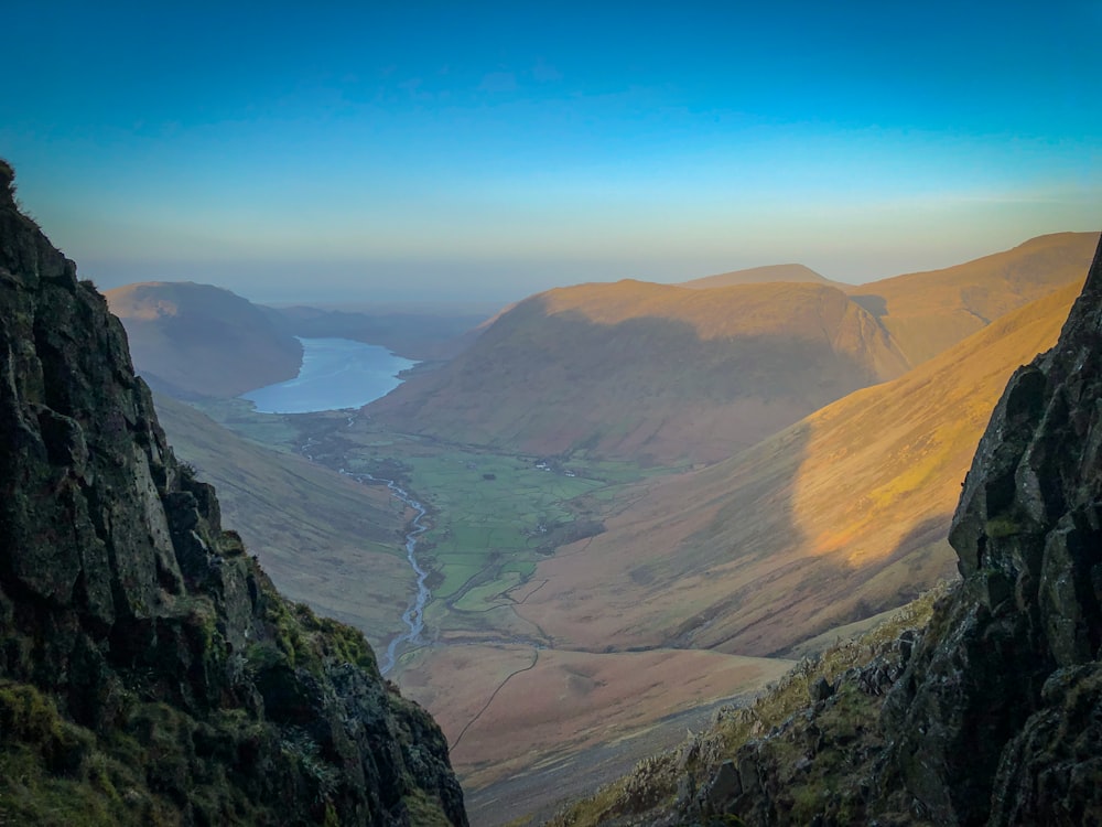 a view of a valley with a river running through it