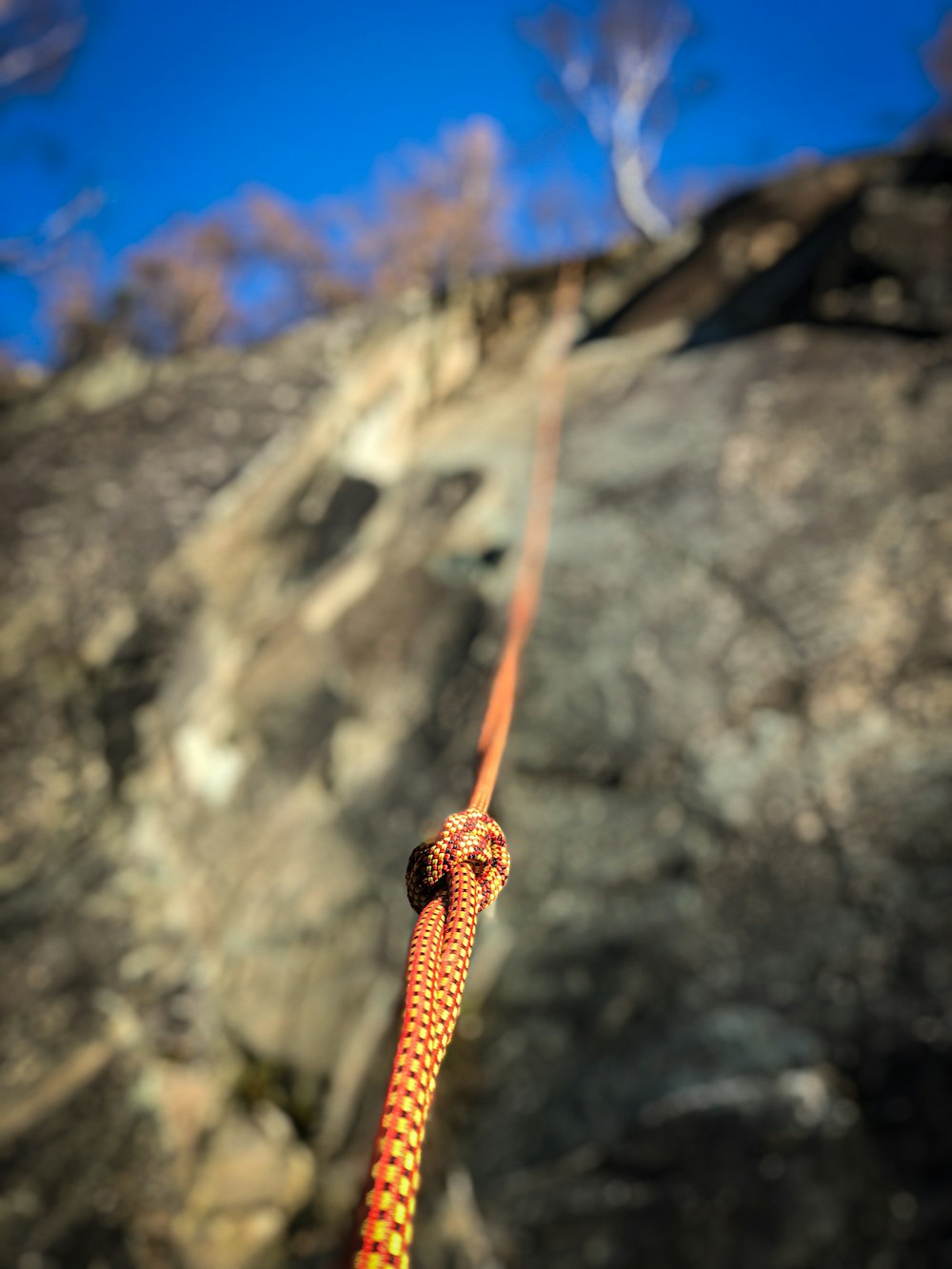 a close up of a rope attached to a rock