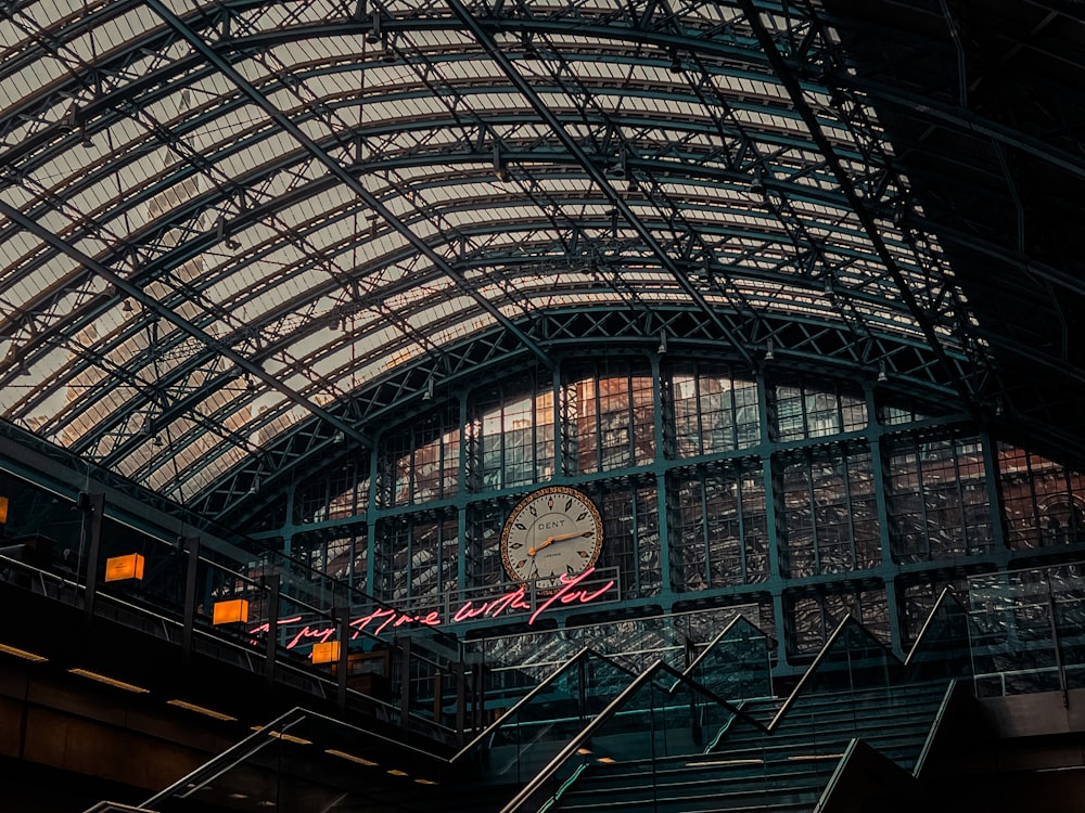 a clock on the wall of a train station