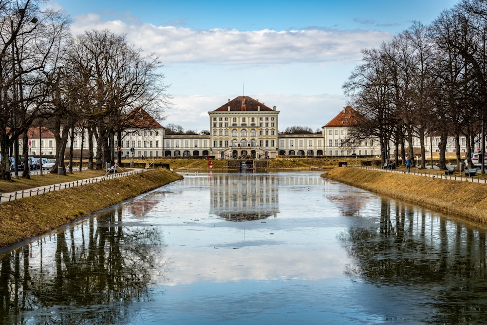 a large building sitting next to a body of water