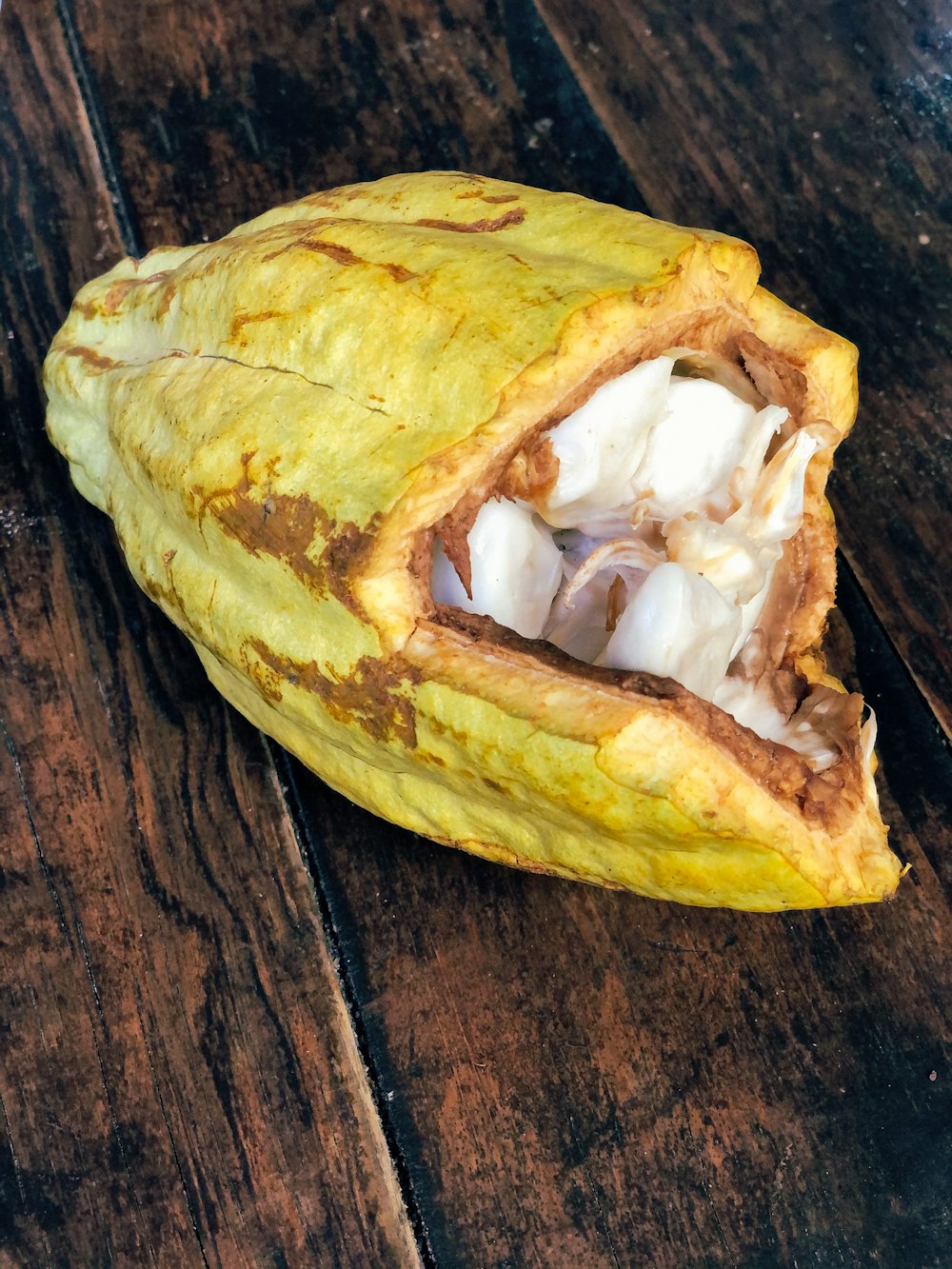 a close up of a fruit on a wooden table