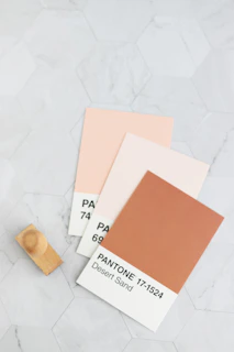 a white marble floor with some different colors of paint