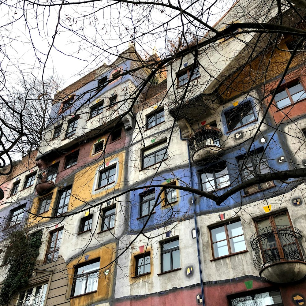 a tall building with many windows and balconies