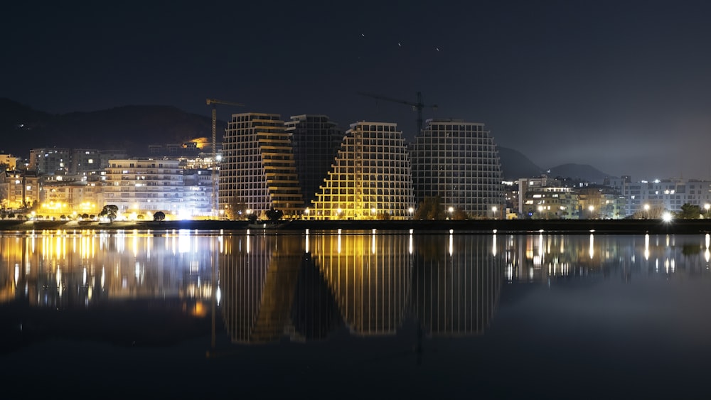 a large body of water with a city in the background