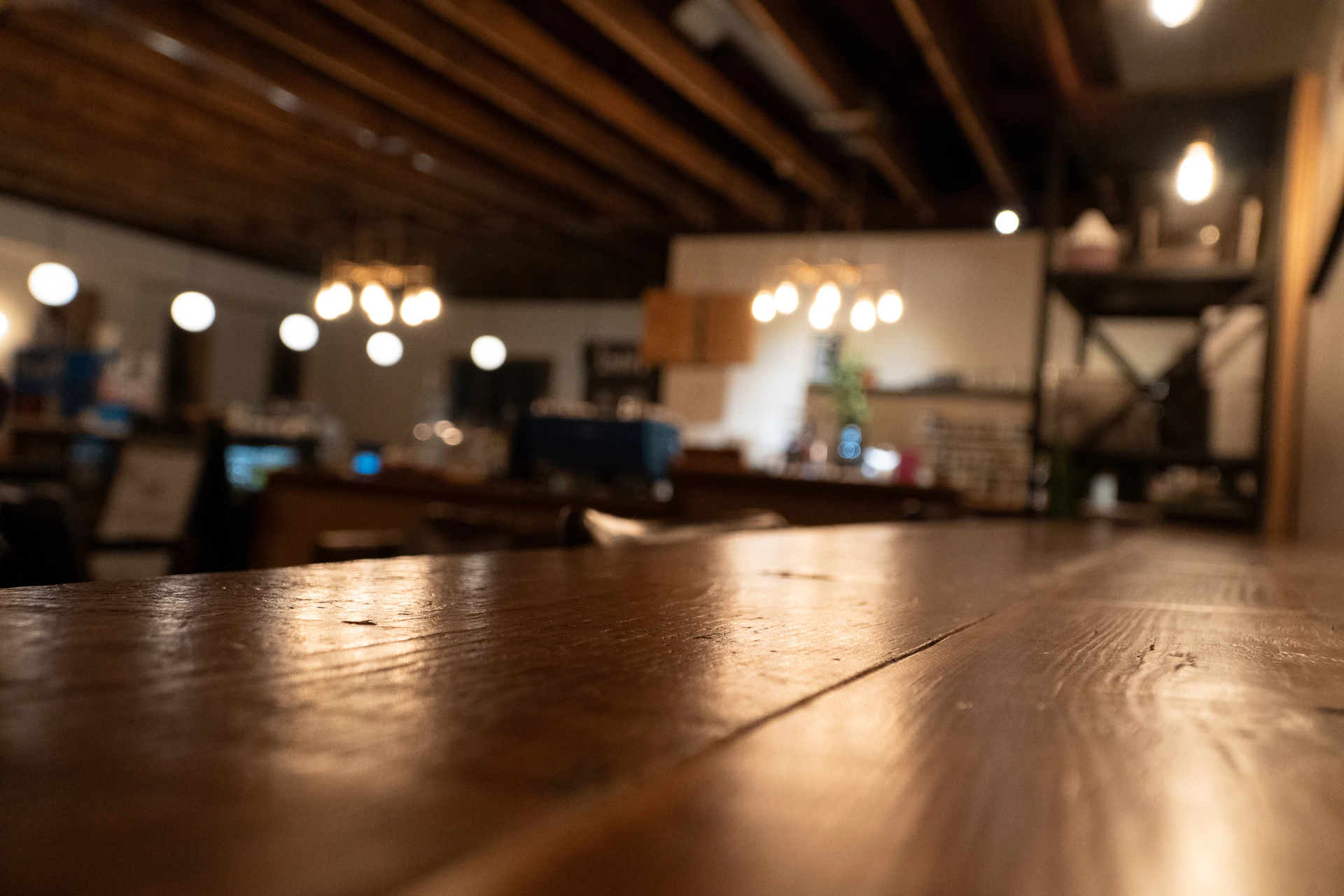 a close up of a wooden table in a restaurant
