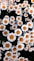 a bunch of white and orange flowers in a field