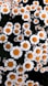 a bunch of white and orange flowers in a field