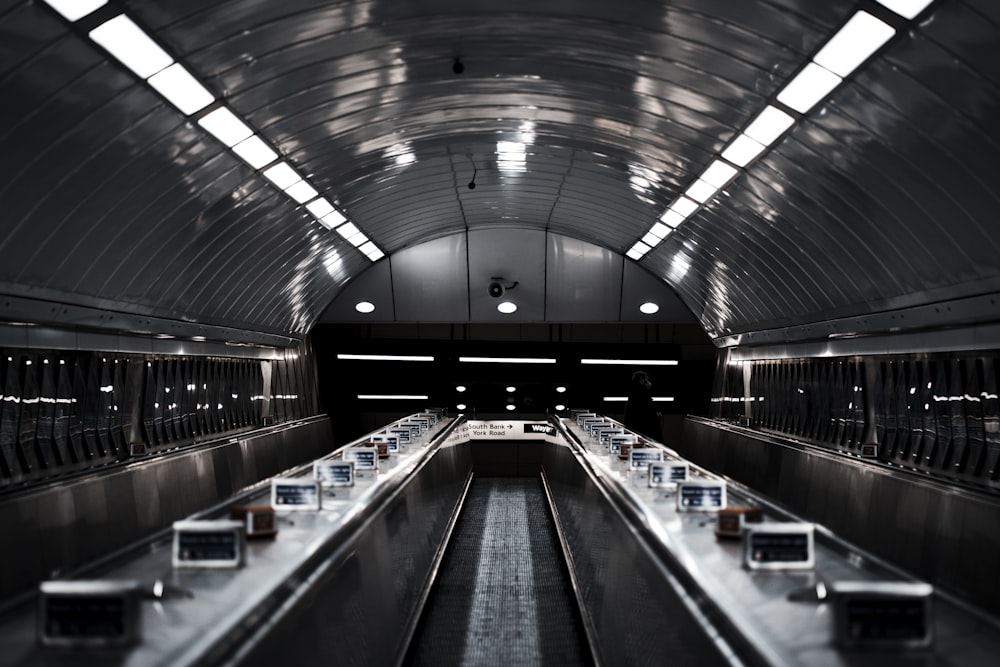 a train station with a row of empty seats