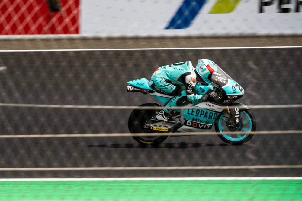 a person riding a motorcycle on a race track