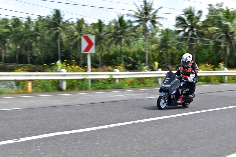 a person riding a motorcycle on a road