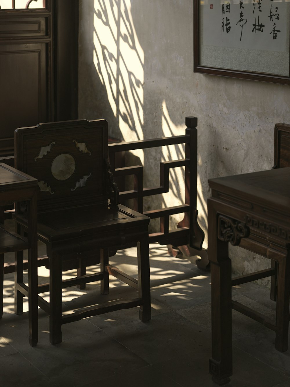 a couple of wooden chairs sitting next to each other