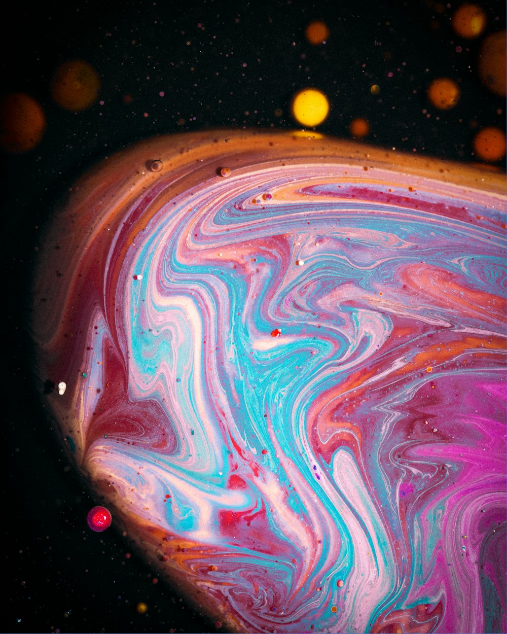 a close up of a colorful liquid substance