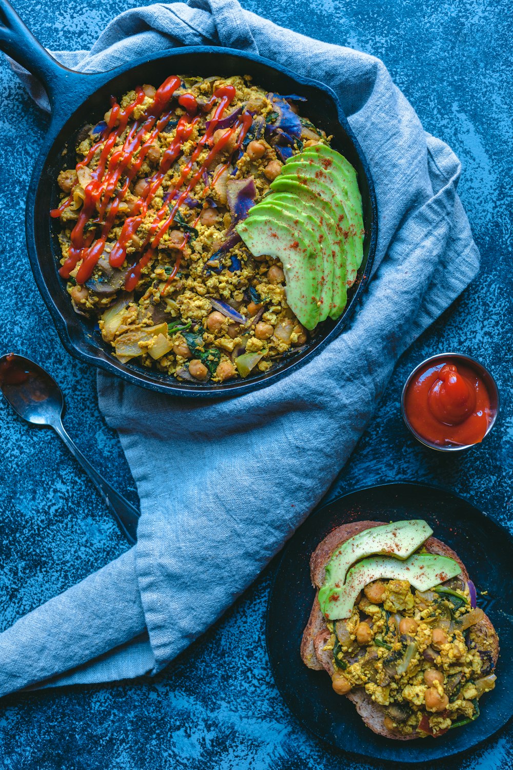 a bowl of food on a table with a spoon