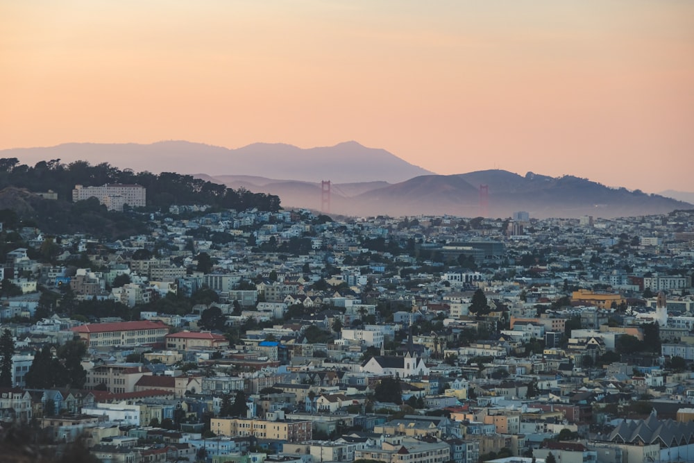 a view of a city with mountains in the background