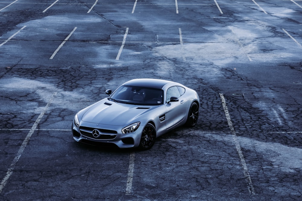 a silver sports car parked in a parking lot