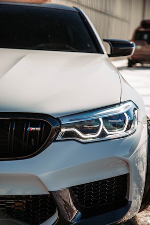a close up of the front of a white car