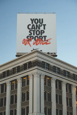 a large billboard on top of a tall building