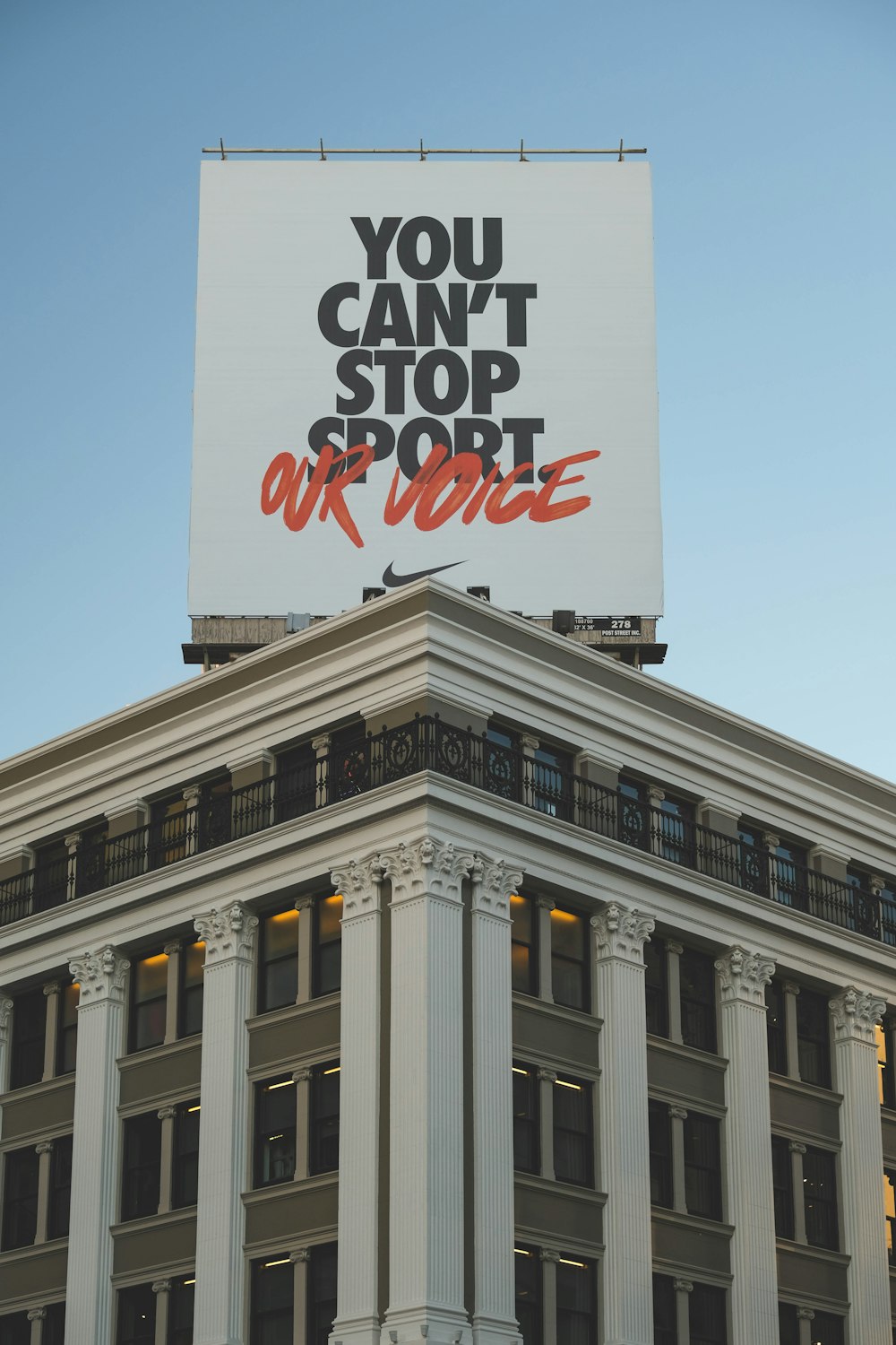 a large billboard on top of a tall building