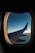 a view of the wing of an airplane through a window