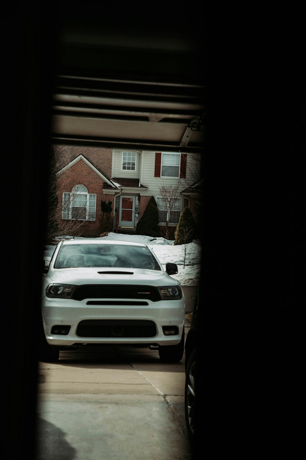 a white car is parked in a garage