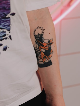 a person with a tattoo on their arm